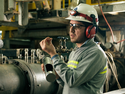 Animal Nutrition - man wearing hardhat and holding pellet